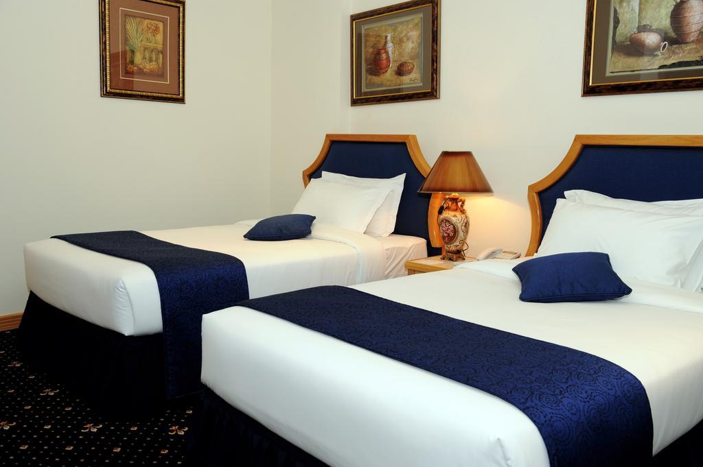 Cayam Hotel Doha Kamer foto
